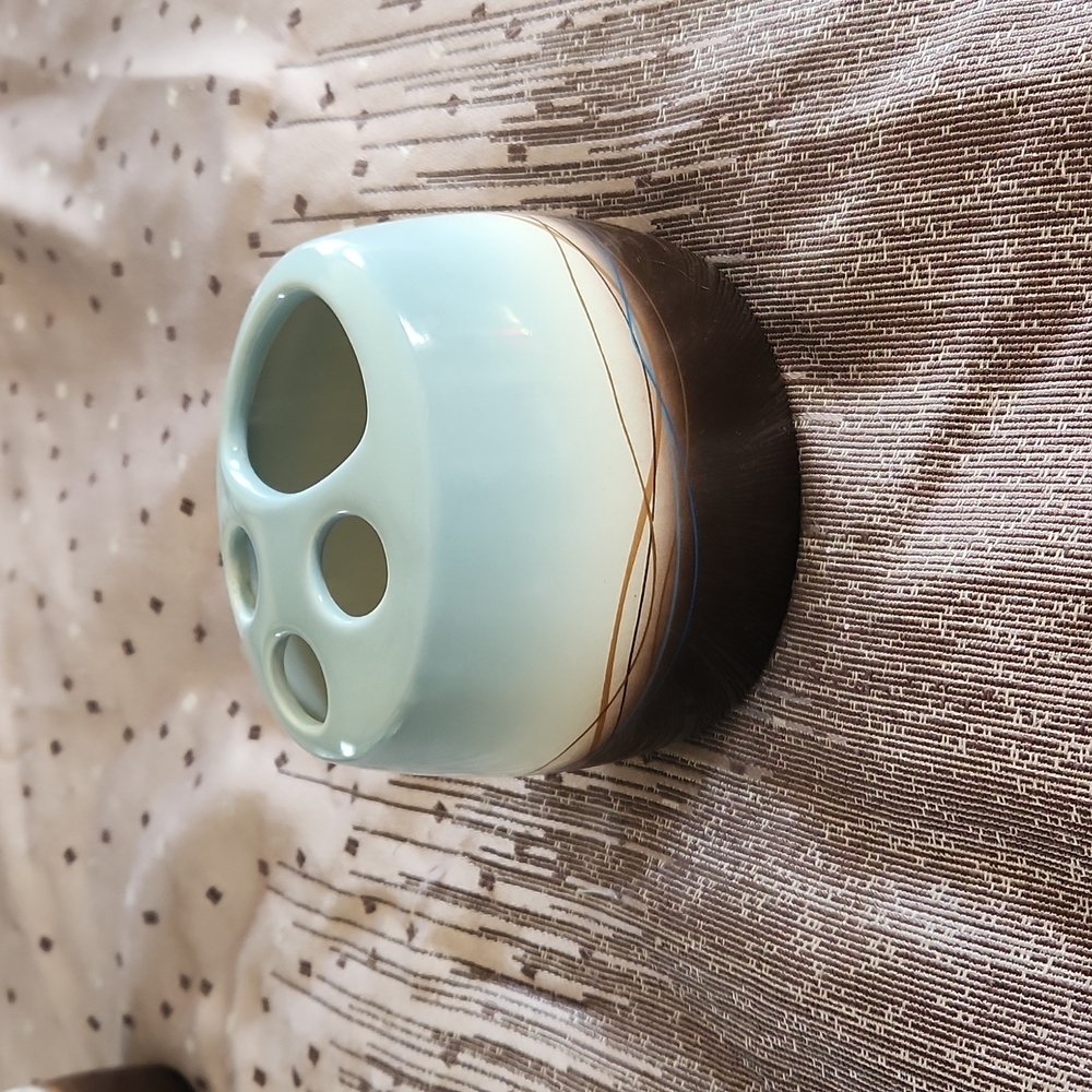 Mystique toothbrush holder